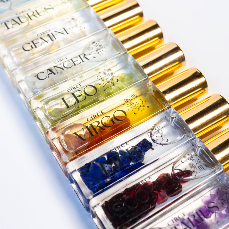 Collection of twelve zodiac perfume oil rollers infused with gemstones