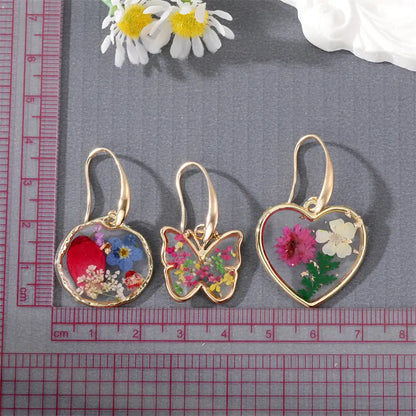 E95-Pressed Flower Butterfly Earrings - Jewelry  from Shein